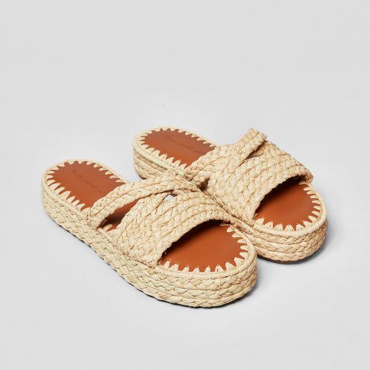 Flätad raffia slip-on sandal